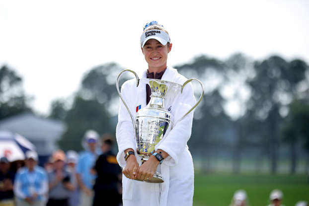 Nelly Korda hugging Chevron Championship trophy made by Malcolm DeMille